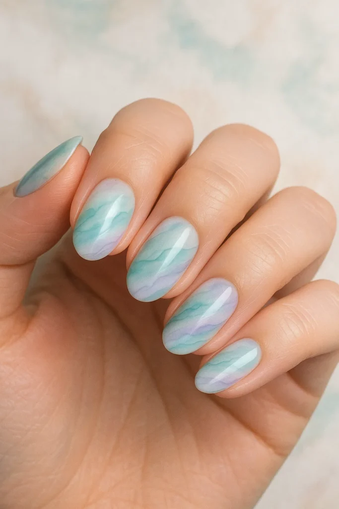 Sandy chic beach nails with trendy designs perfect for summer beach days.