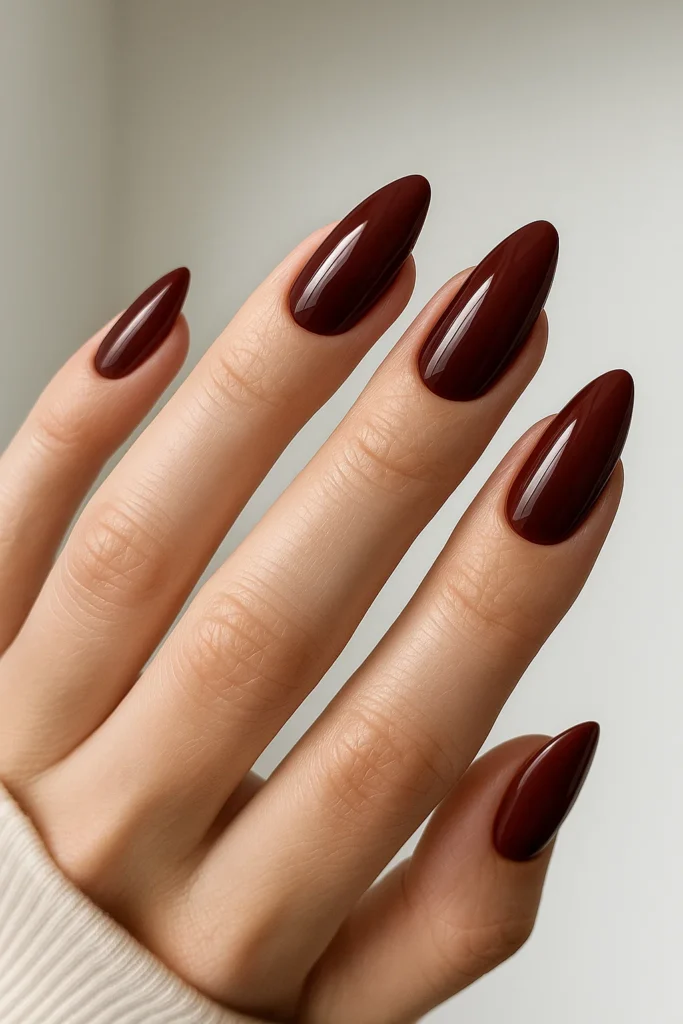 Cherry brown nails with delicate white floral designs