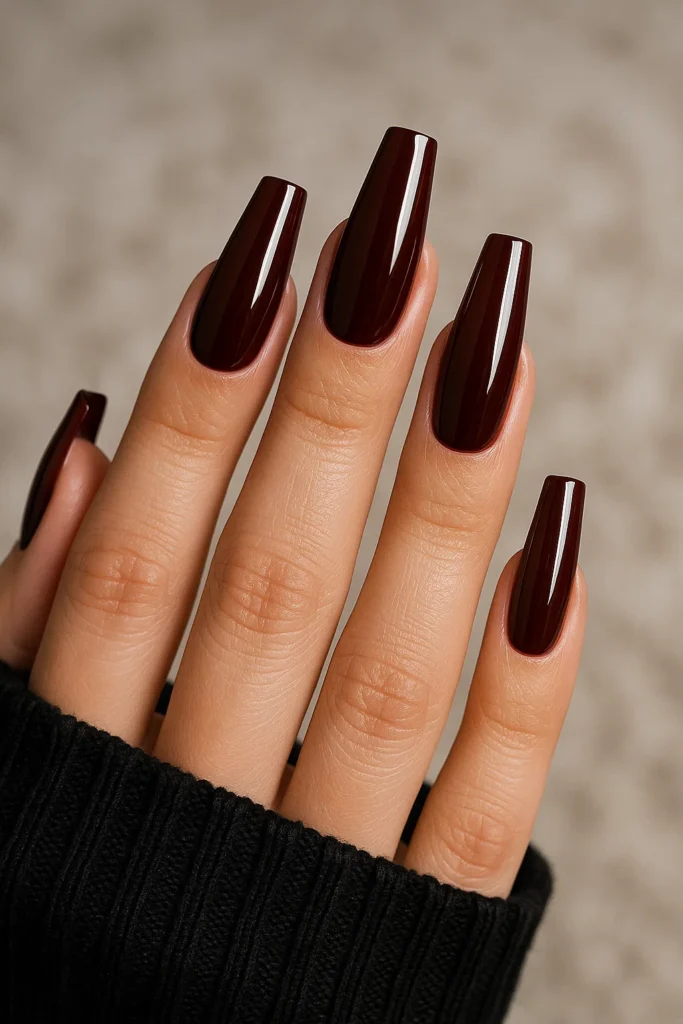 Cherry brown nails with delicate white floral designs