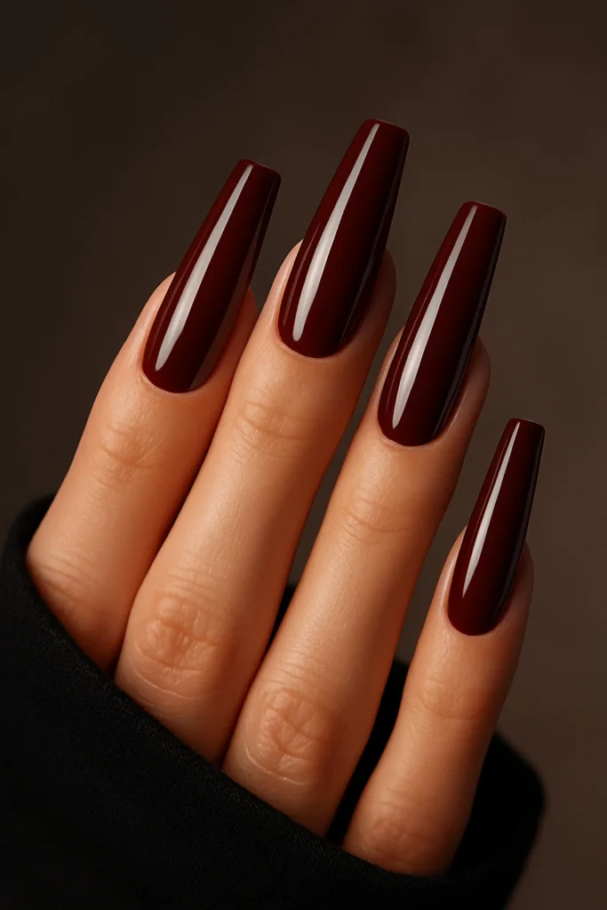Cherry brown nails with delicate white floral designs